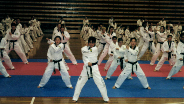 Andre Conate at one of many Taekwondo event. In traditional Dobok (uniform) and martial arts stances.