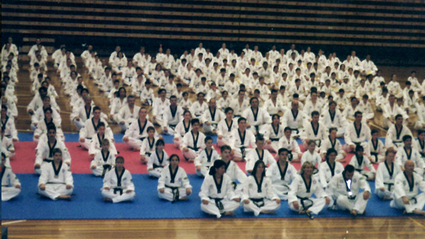 Andre Conate at one of many Taekwondo events. At the front with other top instructors.